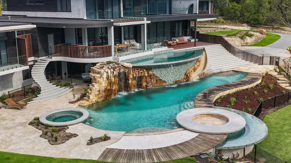 Luxury multi-level concrete pool with rock waterfall feature, Mudgeeraba